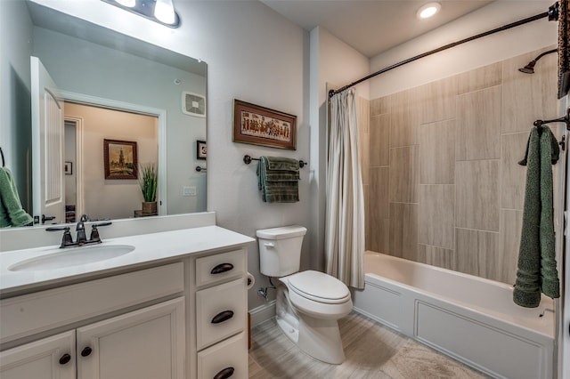 full bathroom with shower / bath combination with curtain, toilet, and vanity