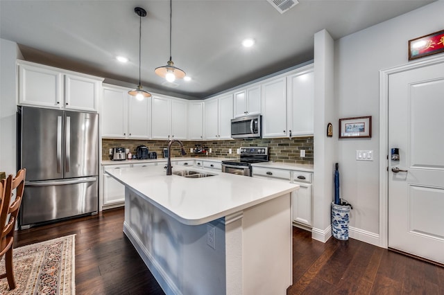 kitchen with dark hardwood / wood-style floors, hanging light fixtures, sink, and appliances with stainless steel finishes