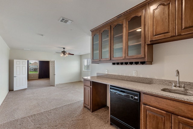 kitchen featuring dishwasher, ceiling fan, sink, and light carpet