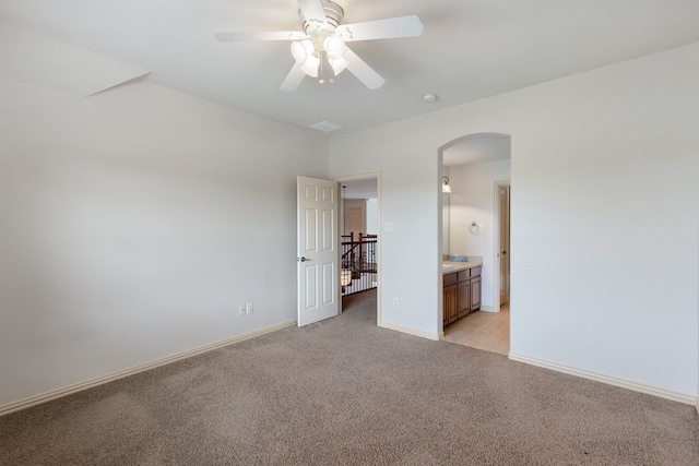 unfurnished room featuring light carpet and ceiling fan