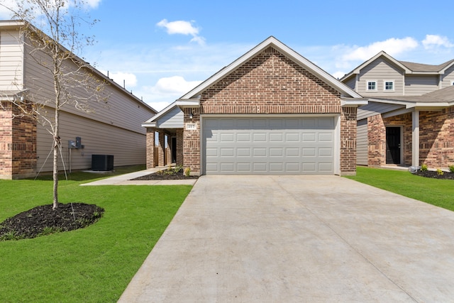 view of front of property featuring a garage, a front lawn, and central AC unit