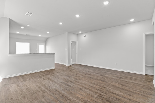 spare room featuring wood-type flooring