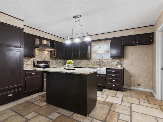 kitchen featuring sink, a kitchen island, decorative light fixtures, stainless steel electric stove, and wall chimney exhaust hood