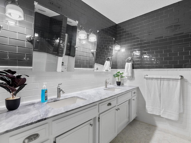 bathroom with vanity and a textured ceiling