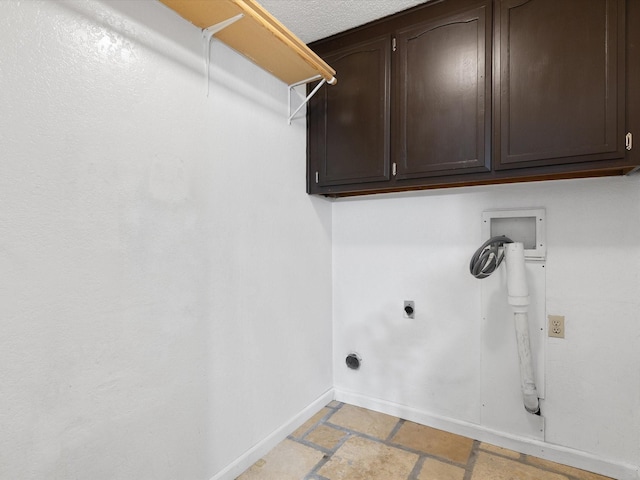 clothes washing area featuring cabinets, hookup for a washing machine, and electric dryer hookup