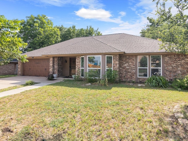 single story home featuring a garage and a front lawn