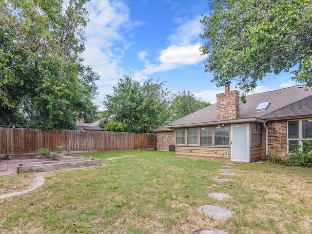 view of yard with a sunroom