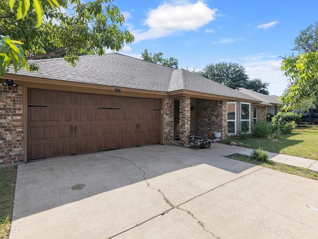 ranch-style house featuring a garage