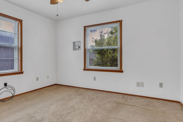 unfurnished bedroom with light carpet, ceiling fan with notable chandelier, and a closet