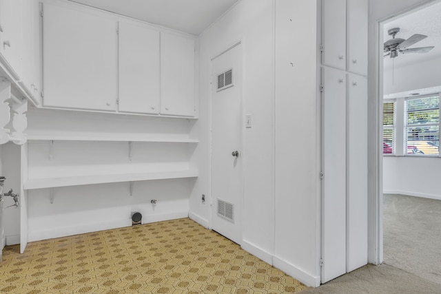 unfurnished room with a textured ceiling and light colored carpet