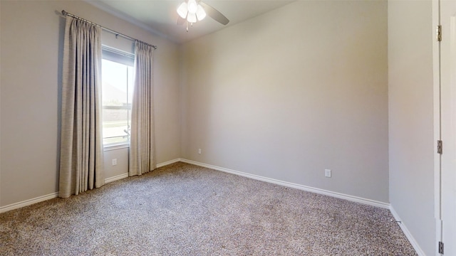 carpeted spare room with ceiling fan