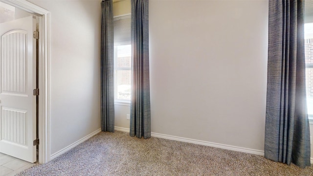 interior space with light colored carpet and baseboards