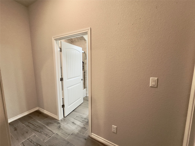 hallway featuring hardwood / wood-style flooring