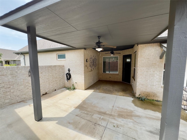 view of patio with fence and ceiling fan