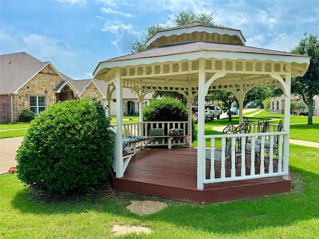 wooden deck with a lawn