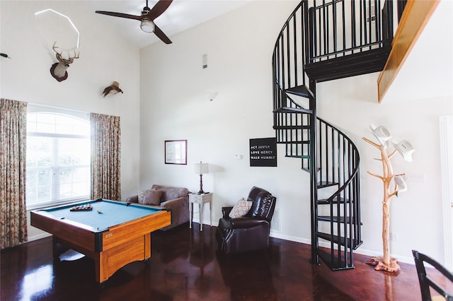 playroom with ceiling fan, a high ceiling, and billiards