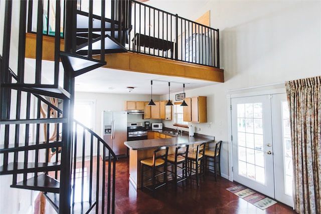 dining area with french doors and sink