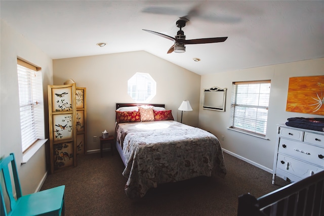 carpeted bedroom featuring multiple windows, ceiling fan, and vaulted ceiling