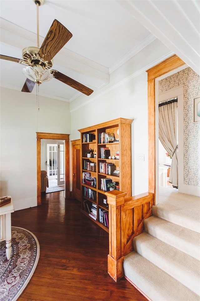 corridor with crown molding and dark wood-type flooring