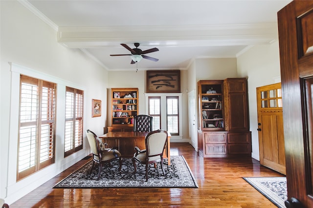 dining space featuring a wealth of natural light, crown molding, and hardwood / wood-style flooring