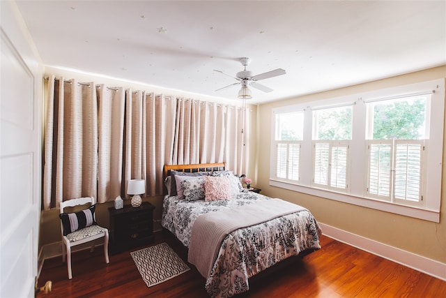 bedroom featuring ceiling fan and dark hardwood / wood-style floors