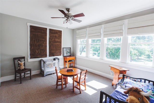 interior space with ceiling fan