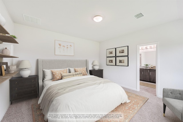 carpeted bedroom with ensuite bathroom