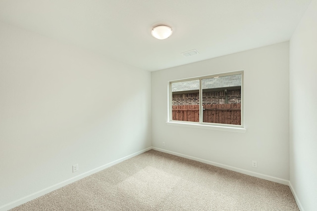 unfurnished room featuring carpet