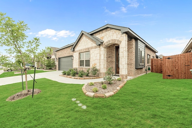 view of front of property with a front yard and a garage