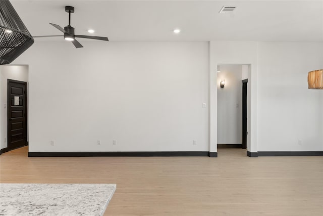 unfurnished room with ceiling fan and light hardwood / wood-style floors