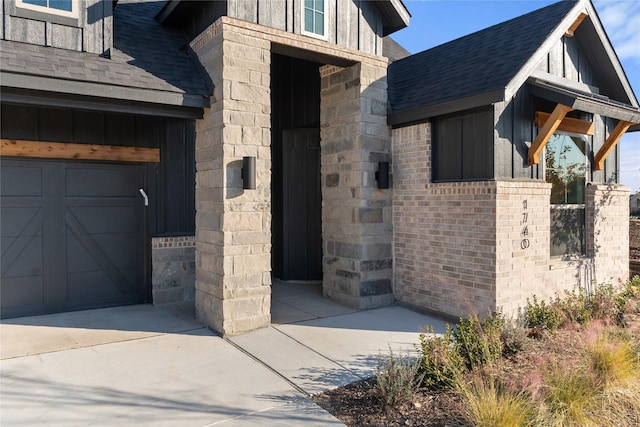 doorway to property featuring a garage