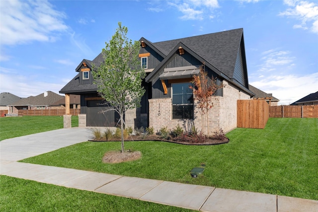 view of front facade featuring a front yard and a garage