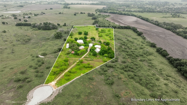 birds eye view of property featuring a rural view