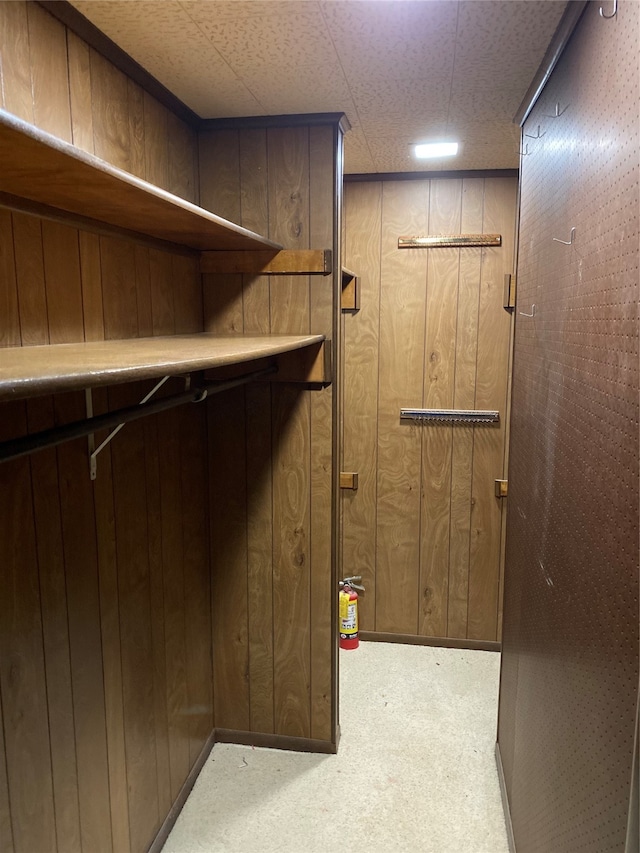 walk in closet featuring a paneled ceiling