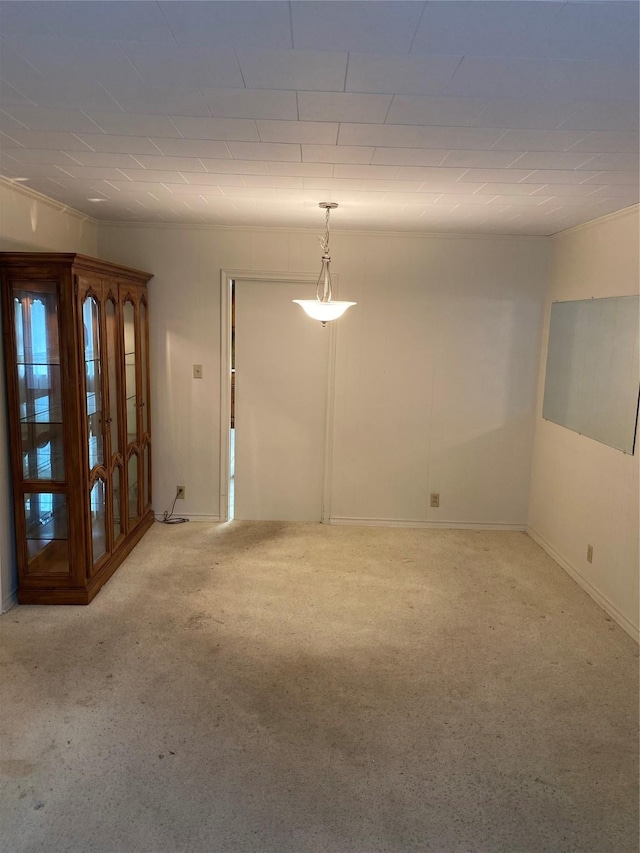 carpeted spare room with baseboards