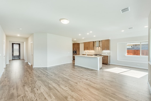 unfurnished living room with light hardwood / wood-style flooring