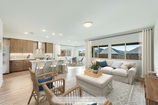 living room with light hardwood / wood-style floors