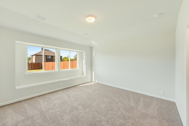 spare room featuring carpet floors