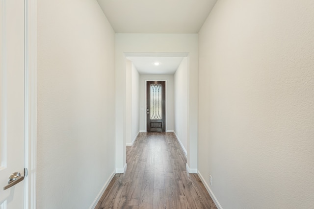 hallway featuring light hardwood / wood-style flooring