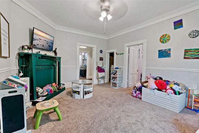 playroom with ornamental molding, carpet floors, and ceiling fan