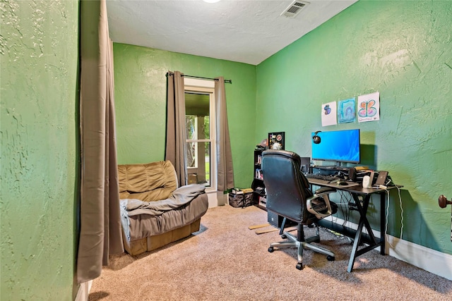 office space with carpet flooring and a textured ceiling