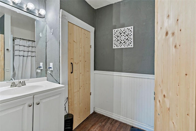 bathroom with vanity and wood-type flooring