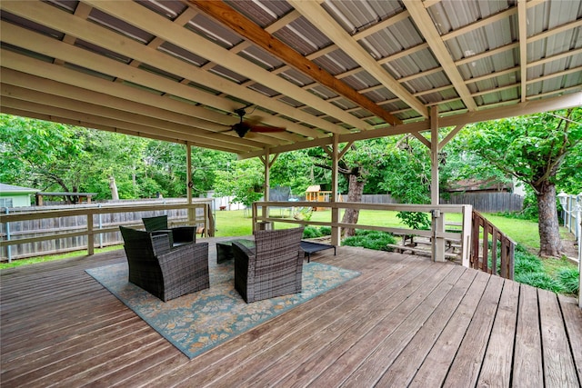 wooden deck featuring an outdoor hangout area and ceiling fan