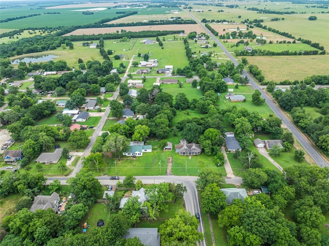 birds eye view of property with a water view and a rural view