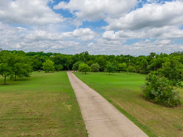 surrounding community featuring a lawn