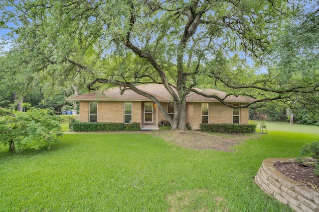 ranch-style house with a front lawn