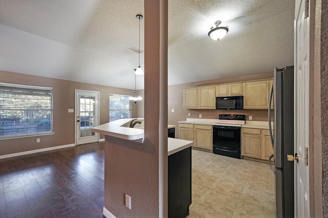 kitchen featuring pendant lighting, light hardwood / wood-style flooring, black appliances, and a textured ceiling