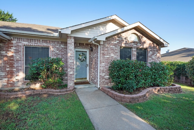 ranch-style home with a front yard