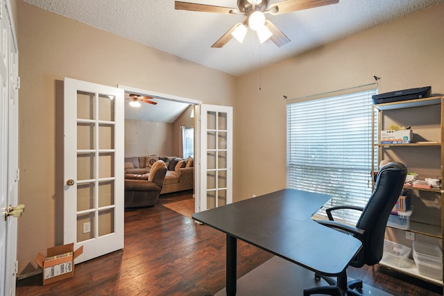 home office featuring vaulted ceiling, french doors, dark wood-type flooring, and a textured ceiling