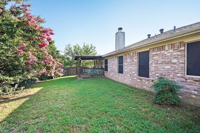 view of yard featuring a wooden deck